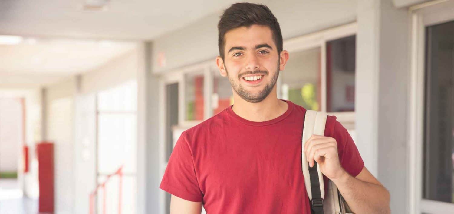 HVAC student in hallway before class.
